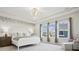 Serene primary bedroom featuring a tray ceiling, decorative chandelier, and ample natural light at 924 Stebbins Dr, Fort Mill, SC 29715