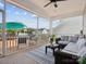 Relaxing screened patio with comfortable seating and views of the well-maintained backyard and neighborhood at 924 Stebbins Dr, Fort Mill, SC 29715