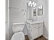 Bathroom featuring a vanity with a mirror, a toilet, and a towel rack at 10301 Shelter Rock Ct, Charlotte, NC 28214