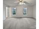Spacious bedroom with neutral tones, plush carpeting, and refreshing natural light at 10301 Shelter Rock Ct, Charlotte, NC 28214