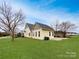 Well-maintained backyard with lush green grass and a view of the house's exterior at 104 Tarrington Dr, Statesville, NC 28625
