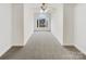 Large empty carpeted bedroom featuring a vaulted window letting in a lot of natural light at 104 Tarrington Dr, Statesville, NC 28625