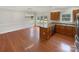Open-concept kitchen with ample cabinet space and a sunlit dining area with stylish pendant lighting at 104 Tarrington Dr, Statesville, NC 28625
