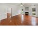 Bright living room boasting hardwood floors, a fireplace, and large windows, creating a warm and inviting ambiance at 104 Tarrington Dr, Statesville, NC 28625