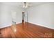 Spacious bedroom with wood floors, ceiling fan and an ensuite bathroom at 104 Tarrington Dr, Statesville, NC 28625