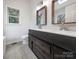 Bathroom featuring dual sinks with framed mirrors and generous counter space at 106 Cape Breton Trl, Gastonia, NC 28056