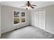A serene bedroom offers ample natural light and closet space at 106 Cape Breton Trl, Gastonia, NC 28056