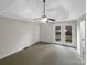 A peaceful primary bedroom suite provides access to the outdoor patio at 106 Cape Breton Trl, Gastonia, NC 28056