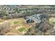 Aerial view of the golf course and club house, with picturesque views at 10615 Persimmon Creek Dr, Mint Hill, NC 28227