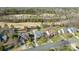 Aerial view of homes backing up to a golf course showcasing lush greenery and neighborhood layout at 10615 Persimmon Creek Dr, Mint Hill, NC 28227