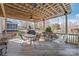 Outdoor deck providing ample seating with a dining area, a swing, and a ceiling fan at 10615 Persimmon Creek Dr, Mint Hill, NC 28227