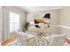 Bright home office with desk, two chairs, area rug, and large window at 10615 Persimmon Creek Dr, Mint Hill, NC 28227
