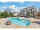 Backyard showcasing an in-ground pool surrounded by manicured landscaping and a patio at 10615 Persimmon Creek Dr, Mint Hill, NC 28227
