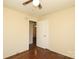 Bedroom showcasing hardwood floors, ceiling fan, and a connecting door at 107 Stanford Dr, Stanley, NC 28164