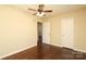 Bedroom with hardwood floors, ceiling fan, a window, and a closet door at 107 Stanford Dr, Stanley, NC 28164