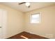 Standard bedroom featuring hardwood floors, a ceiling fan, and natural light at 107 Stanford Dr, Stanley, NC 28164