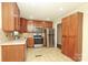 Kitchen featuring stainless steel appliances and a tile backsplash at 107 Stanford Dr, Stanley, NC 28164