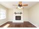 Hardwood floor living room with a decorative fireplace and bright natural light at 107 Stanford Dr, Stanley, NC 28164