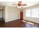 Cozy living room featuring beautiful hardwood floors, a ceiling fan, and a bright window at 107 Stanford Dr, Stanley, NC 28164