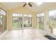 Sunroom features lots of natural light with windows all around and tile floors at 10914 Ridge Acres Rd, Charlotte, NC 28214