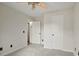 Bedroom with neutral carpeting, a ceiling fan, two closets, and white doors at 113 Misty Spring Rd, Troutman, NC 28166