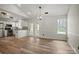 Modern kitchen featuring stainless steel appliances, white cabinetry, and granite countertops at 113 Misty Spring Rd, Troutman, NC 28166