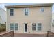 Back exterior view of home featuring vinyl siding, windows, and a wood deck at 114 Sheridan Ct, Mooresville, NC 28115
