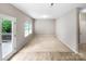 Bright and airy bedroom with neutral walls, new carpeting, and natural light from multiple windows at 114 Sheridan Ct, Mooresville, NC 28115