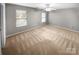 Bright bedroom with neutral walls, plush carpeting, ceiling fan, and natural light at 114 Sheridan Ct, Mooresville, NC 28115
