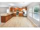 Well-lit kitchen featuring wood cabinets, stainless steel appliances, and an eat-in area at 114 Sheridan Ct, Mooresville, NC 28115