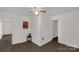 Bedroom featuring wood-look flooring, ceiling fan, and access to additional rooms at 1141 6Th St, Lancaster, SC 29720