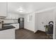 Compact kitchen space featuring a stainless steel refrigerator and adjacent utility closet at 1141 6Th St, Lancaster, SC 29720