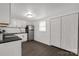 Compact kitchen space featuring a stainless steel refrigerator and adjacent closet area at 1141 6Th St, Lancaster, SC 29720