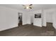 Open living room with modern flooring, neutral walls, and views into the kitchen and bathroom at 1141 6Th St, Lancaster, SC 29720
