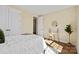 Cozy bedroom has ample lighting and a modern workspace near the bed, bathed in natural light at 13101 Cozy Ct, Charlotte, NC 28215