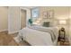 Bright, sunlit bedroom with white bed linens, a scenic window view, and walk-in closet at 13101 Cozy Ct, Charlotte, NC 28215