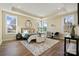 Serene bedroom with tray ceiling, large windows, hardwood flooring, and neutral decor at 13101 Cozy Ct, Charlotte, NC 28215