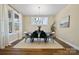 Bright dining area with large windows, stylish seating, and modern decor at 13101 Cozy Ct, Charlotte, NC 28215