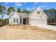 Beautiful new construction home features a three car garage and stone accents at 13101 Cozy Ct, Charlotte, NC 28215