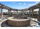 Inviting brick fire pit surrounded by comfortable seating, creating a cozy and communal gathering spot at 13101 Cozy Ct, Charlotte, NC 28215