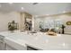 The kitchen includes a large farmhouse sink and an open floor plan that opens to the living area at 13101 Cozy Ct, Charlotte, NC 28215