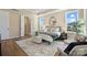 A stylish bedroom features a tray ceiling, ensuite, and a soft rug, offering comfort and elegance at 13101 Cozy Ct, Charlotte, NC 28215