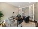 Home office with french doors offering privacy and natural light, neutral paint, and simple decor at 13101 Cozy Ct, Charlotte, NC 28215