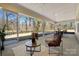 Screened-in porch features comfortable seating and a view of the outdoors at 13101 Cozy Ct, Charlotte, NC 28215