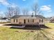 Charming one-story home featuring a inviting front porch, neutral color palette, and manicured lawn at 1311 Shady Oak Trl, Gastonia, NC 28052
