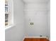 Functional laundry room features a utility sink and a window that provides natural light at 1311 Shady Oak Trl, Gastonia, NC 28052