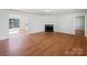Spacious living room features hardwood floors and a fireplace, perfect for relaxing and entertaining guests at 1311 Shady Oak Trl, Gastonia, NC 28052