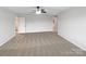 Expansive bedroom with a ceiling fan, neutral carpeting, and plenty of room to unwind and relax at 133 Sequoia St, Mooresville, NC 28117