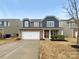 Charming two-story home with stone accents, a two-car garage, and manicured landscaping at 133 Sequoia St, Mooresville, NC 28117