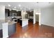 Modern kitchen with dark cabinetry, stainless steel appliances, and center island at 133 Sequoia St, Mooresville, NC 28117